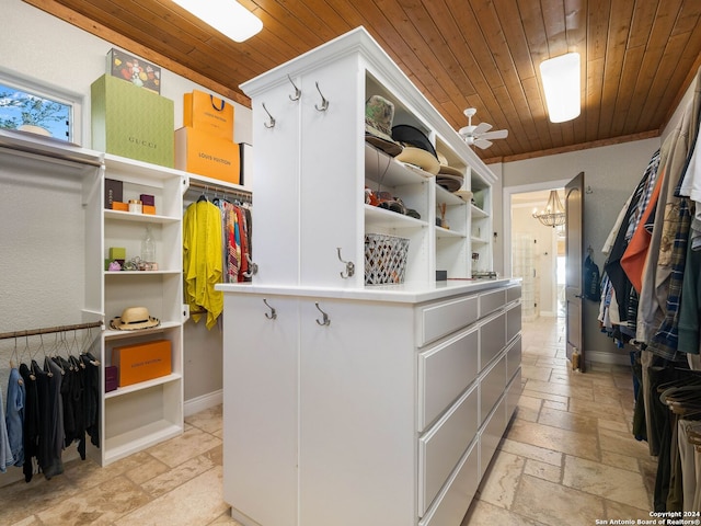 spacious closet with ceiling fan