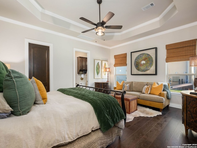 bedroom featuring a raised ceiling, ceiling fan, crown molding, and dark hardwood / wood-style floors