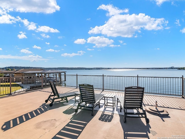 view of patio with a water view