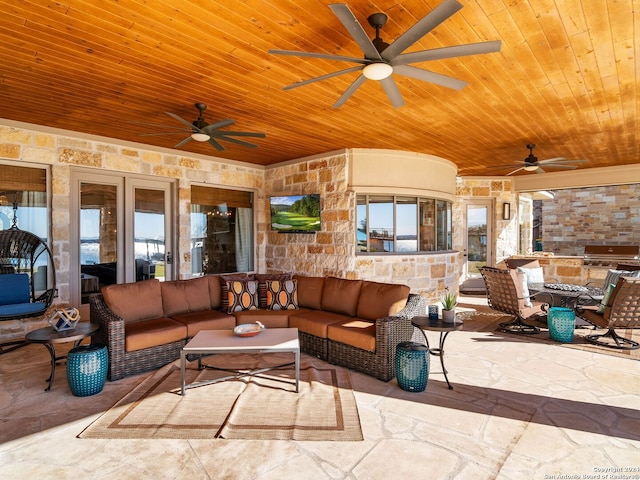 exterior space featuring an outdoor living space, area for grilling, and ceiling fan