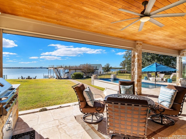 view of patio with ceiling fan and a water view