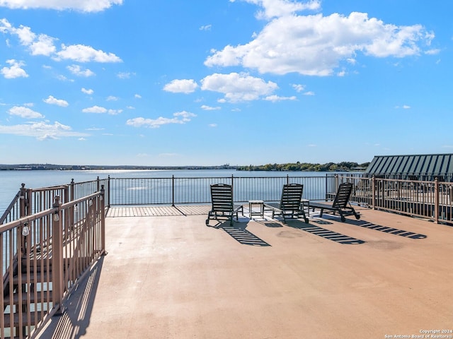 view of patio featuring a water view