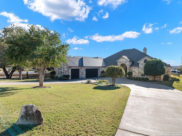 single story home with a front lawn and a garage