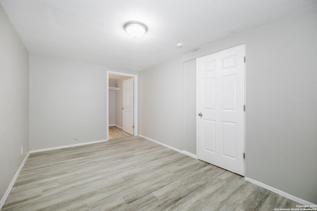 spare room featuring light hardwood / wood-style flooring