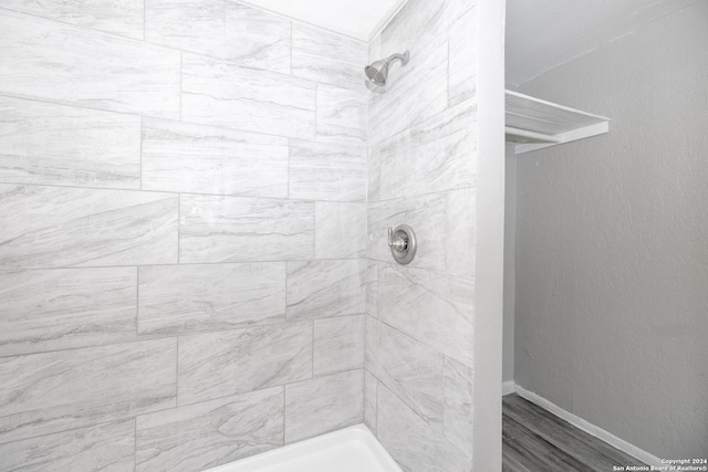 bathroom with a tile shower