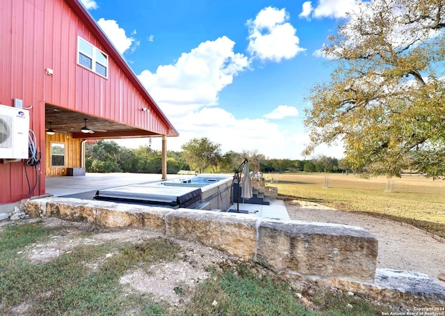 view of yard featuring ac unit and ceiling fan