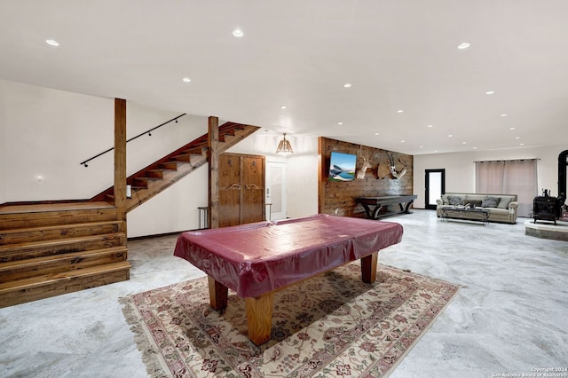 rec room featuring a wood stove and billiards