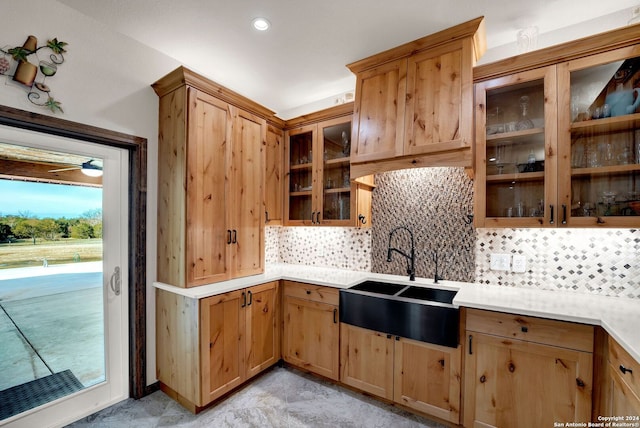 kitchen featuring sink and tasteful backsplash