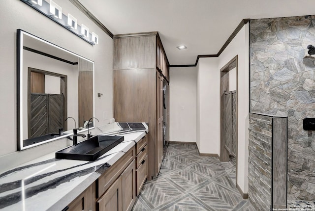 bathroom featuring vanity and crown molding