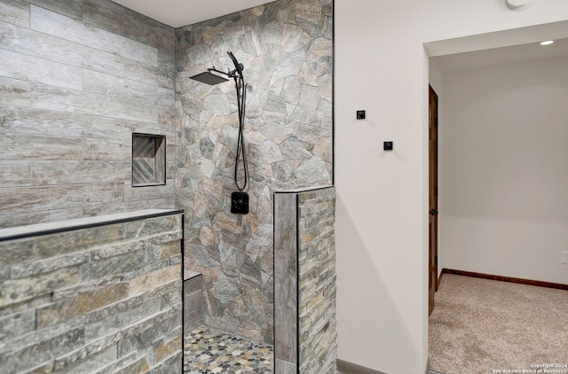 bathroom with a tile shower