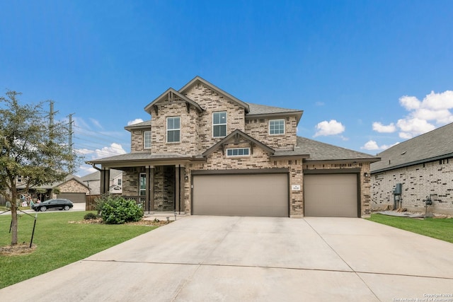 craftsman-style home featuring a garage and a front lawn