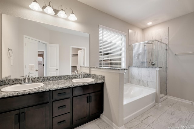 bathroom featuring vanity and independent shower and bath