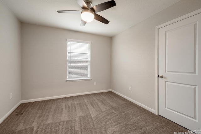 unfurnished room featuring carpet floors and ceiling fan