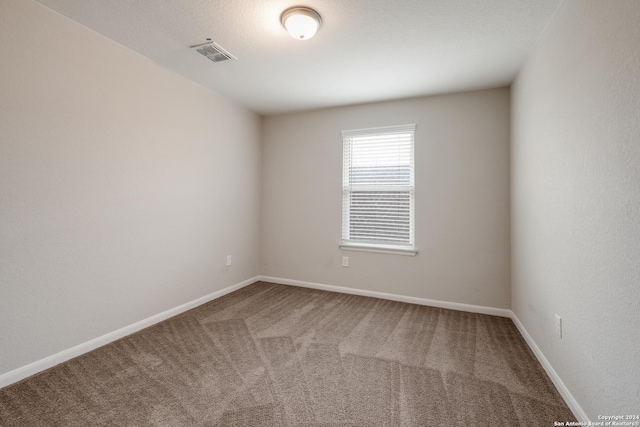 spare room featuring carpet flooring