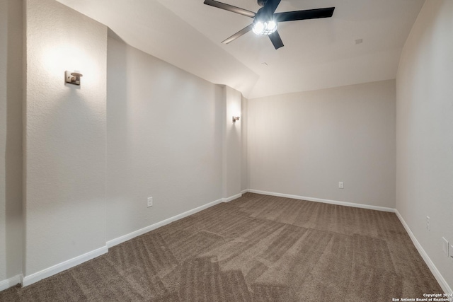 empty room featuring carpet flooring, ceiling fan, and lofted ceiling