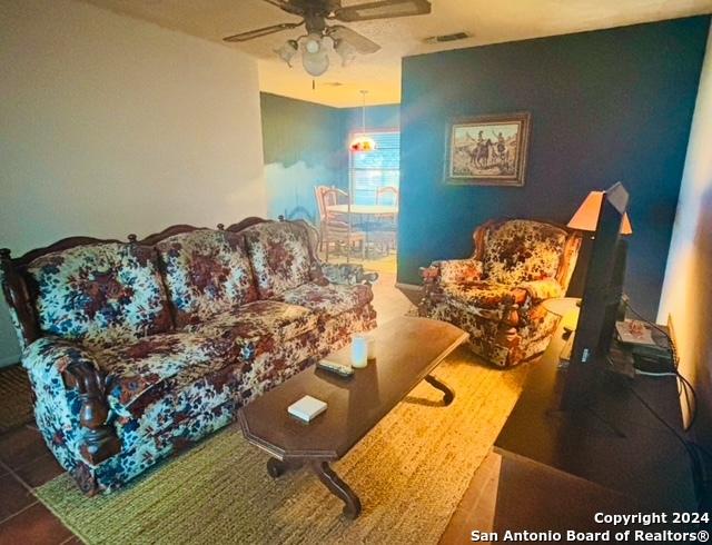 living room with ceiling fan