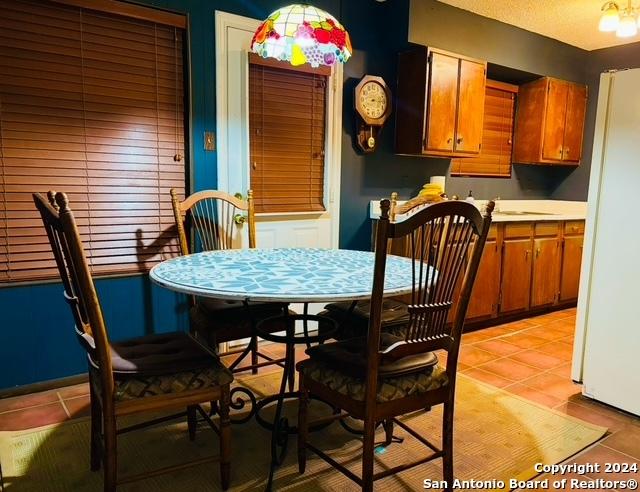 dining area featuring light tile patterned floors