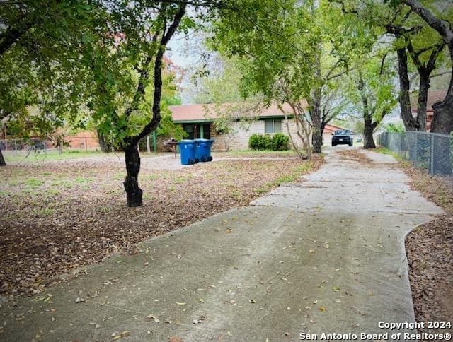 1254 Encino Dr, Pleasanton, TX 78064 - view of yard with concrete driveway