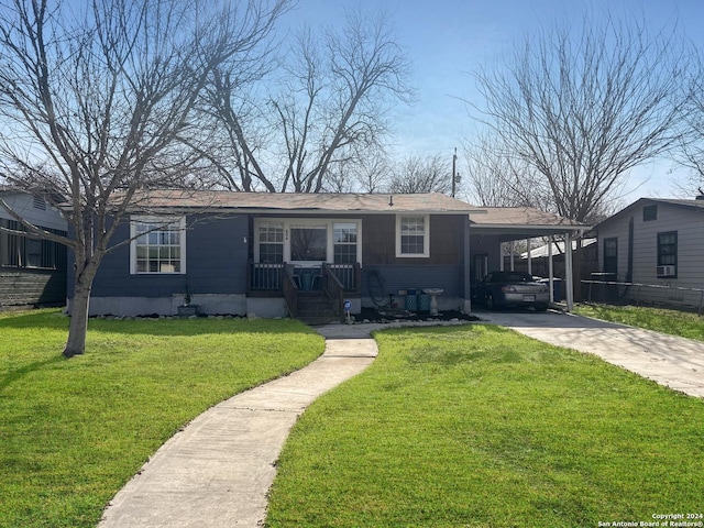 ranch-style house with a front yard and a carport