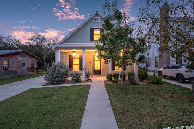 315 Hickman, Boerne, TX 78006 - view of front facade with covered porch, a yard, and cooling unit