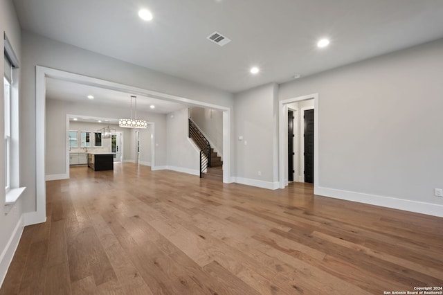 unfurnished living room featuring light wood-type flooring