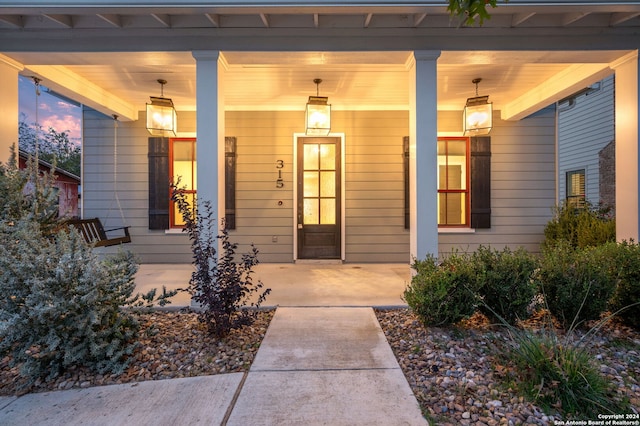 entrance to property with a porch