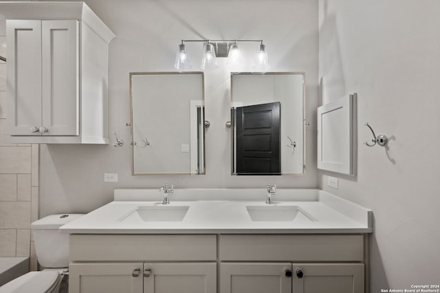 bathroom featuring vanity and toilet