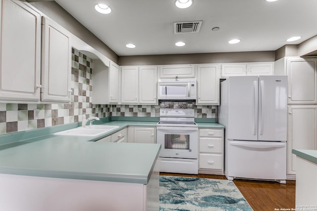 kitchen featuring white cabinetry, white appliances, and sink