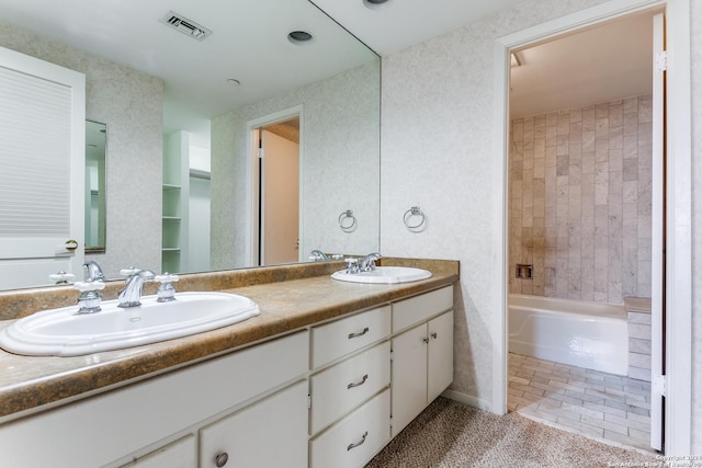 bathroom featuring shower / bathing tub combination, vanity, and tile patterned floors