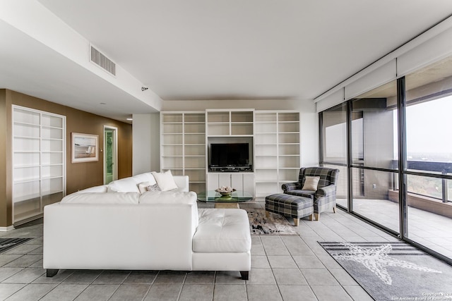 living room with light tile patterned floors