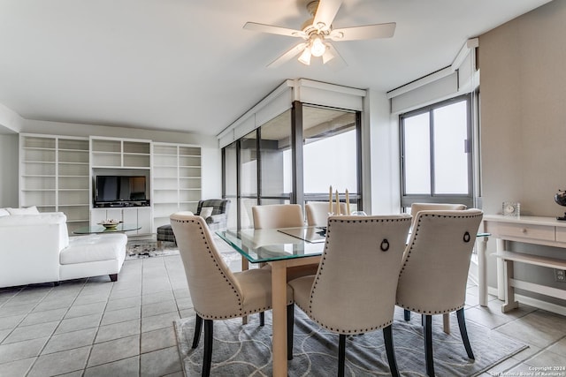 tiled dining area featuring ceiling fan