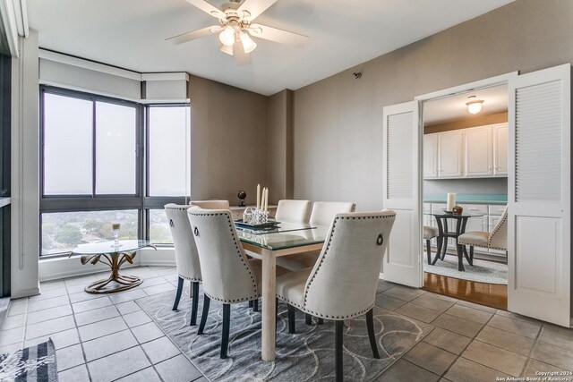 dining room with tile patterned flooring and ceiling fan