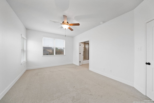 empty room with light carpet and ceiling fan