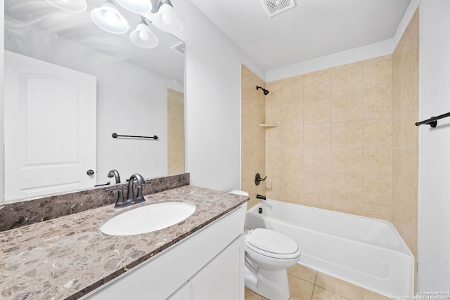 full bathroom with tile patterned flooring, vanity, toilet, and tiled shower / bath