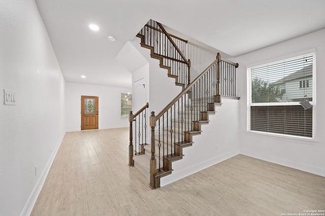 stairway featuring hardwood / wood-style floors