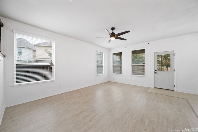 spare room featuring ceiling fan and light wood-type flooring