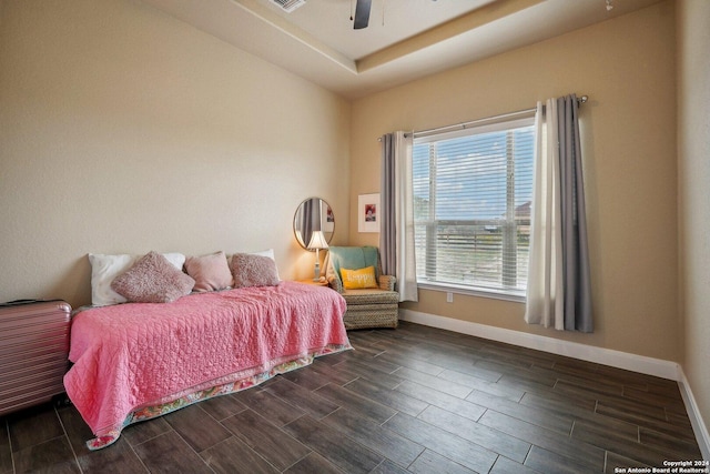 bedroom with ceiling fan and dark hardwood / wood-style flooring