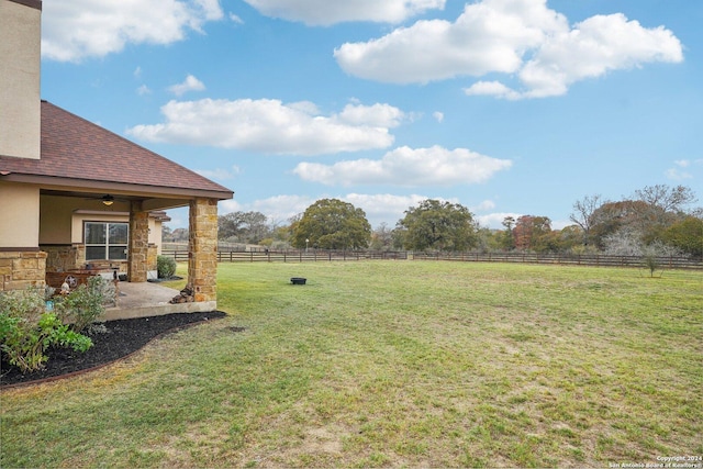 view of yard with a rural view