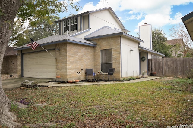 back of house featuring a lawn