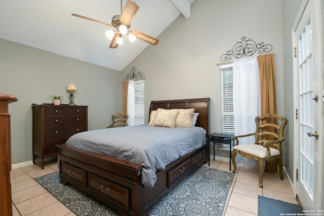 bedroom with multiple windows, ceiling fan, light tile patterned floors, and high vaulted ceiling