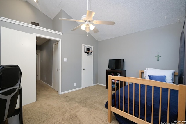 bedroom with a textured ceiling, light colored carpet, ceiling fan, and lofted ceiling