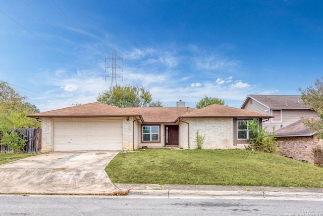 ranch-style house featuring a front lawn and a garage