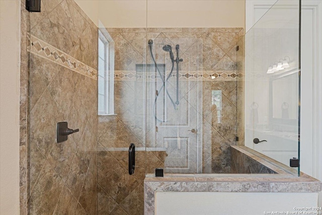 bathroom featuring an enclosed shower