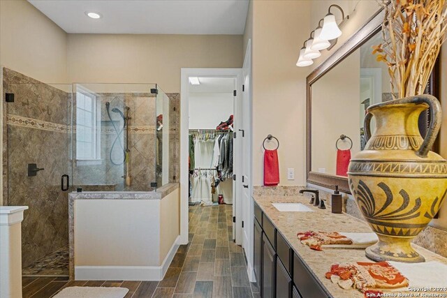 bathroom featuring vanity and walk in shower