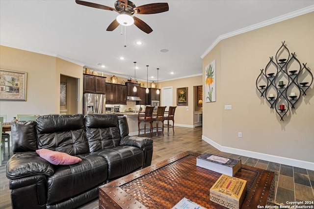 living room featuring ceiling fan, dark hardwood / wood-style floors, and ornamental molding