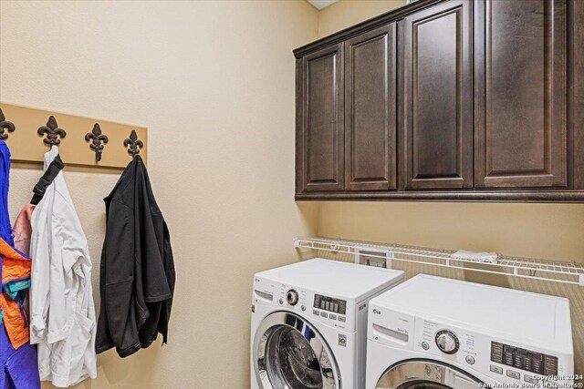 laundry area featuring cabinets and independent washer and dryer