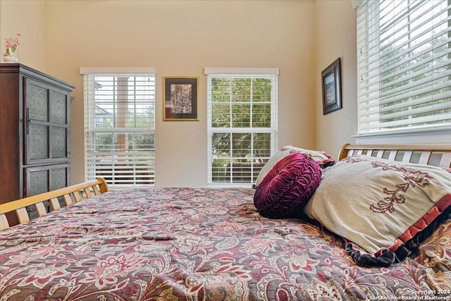 bedroom featuring multiple windows