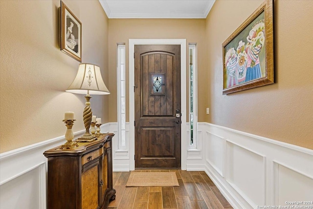 entryway featuring crown molding and dark wood-type flooring