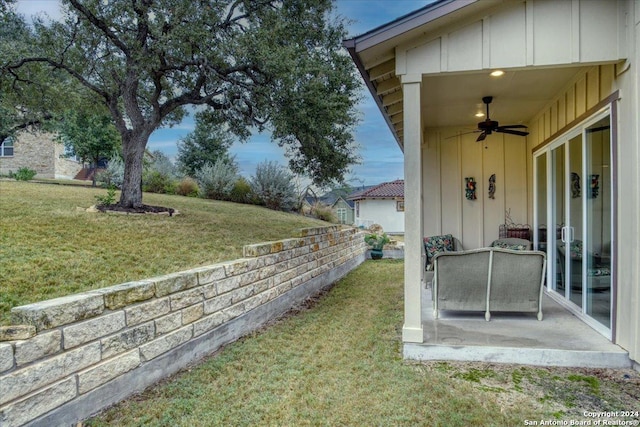 view of yard featuring a patio and ceiling fan