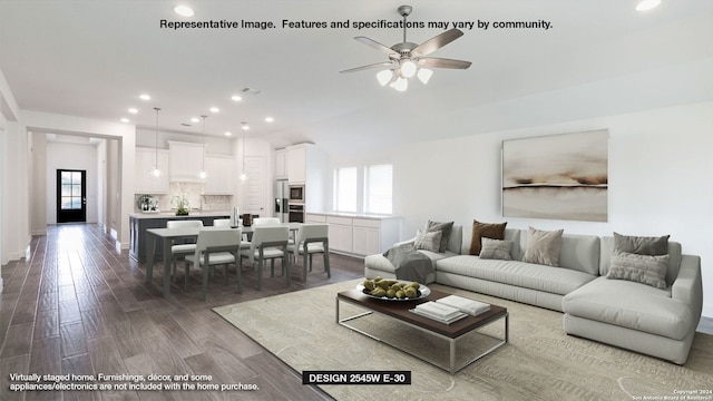 living room featuring dark wood-style floors, baseboards, a ceiling fan, and recessed lighting